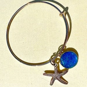 Resin blue round charm, starfish charm adjustable bracelet.
